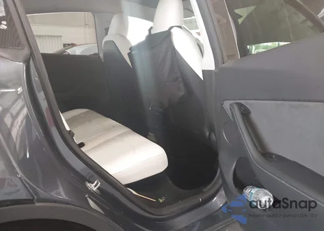 2023 Tesla Model Y Awd/Long Range Dual Motor All-Wheel Drive z USA, uszkodzony, nr VIN 7SAYGDEE4PF799452